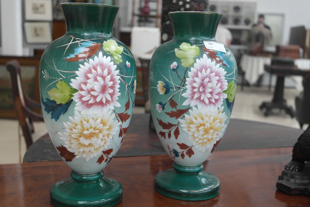 A pair of painted glass urns,