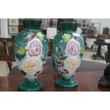 A pair of painted glass urns,