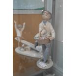 A Lladro figure of a boy with umbrella;