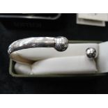 A gentleman's heavy silver torque bangle