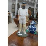 A resin figure of W G Grace in cricket attire