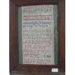 A framed and glazed sampler of the alphabet by SarahJ Morrow aged 9 years (1812)