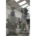 Two Lladro figurines of a girl holding an umbrella and a milkmaid