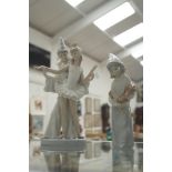 A Lladro figure of a a theatrical couple;