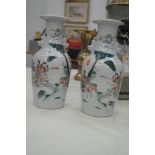 A pair of 19th century Chinese famille rose vases with figural garden scenes