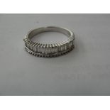 An 18ct Iliana half eternity ring set with baguette diamonds