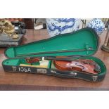 A boxed child's violin and bow