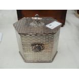 An Arts & Crafts silver-plate on  copper tea caddy