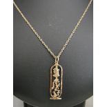 A 9ct chain and high carat Egyptian hieroglyphic pendant