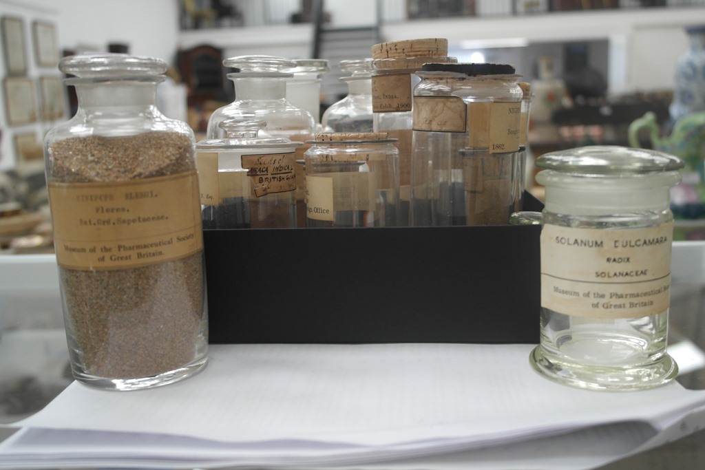 A quantity of 19th century and lagter glass pharmaceutical jars