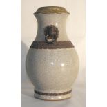 A 19th Century Chinese Stoneware Vase:
of archaistic shape and covered in a thick crackled light