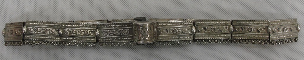 A 19th Century Russian Silver Belt:
a sleeved leather belt with 16 moulded silver sections and loop