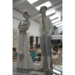 Two LLadro figurines of a man and a Victorian lady