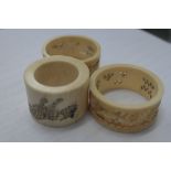 1930s ivory napkin rings with dragon design;