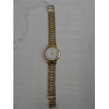 A 9ct Geneve ladies gold dress watch on gold strap