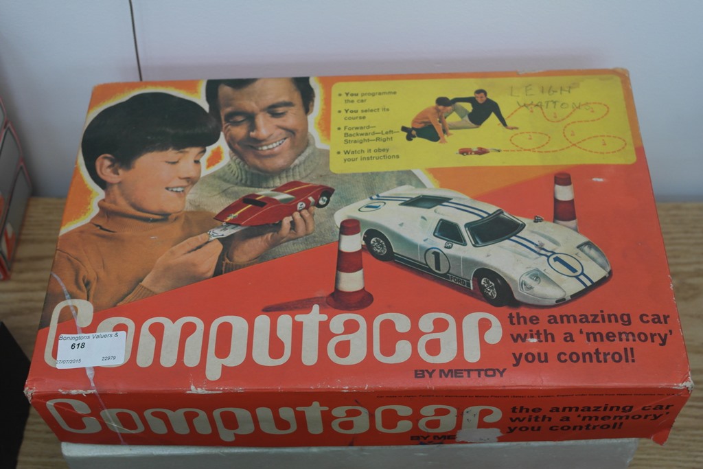 A boxed Computacar vintage car game with accessories and others