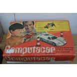 A boxed Computacar vintage car game with accessories and others