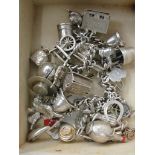 A silver charm bracelet and loose charms