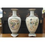 A pair of Japanese enamelled vases with lady and boy decoration