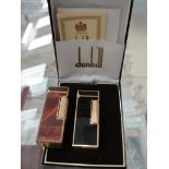 A cased Dunhill lighter;