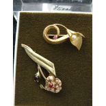 Two 9ct gold floral brooches