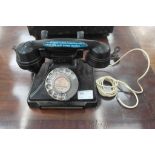 A 1940s black bakelite telephone