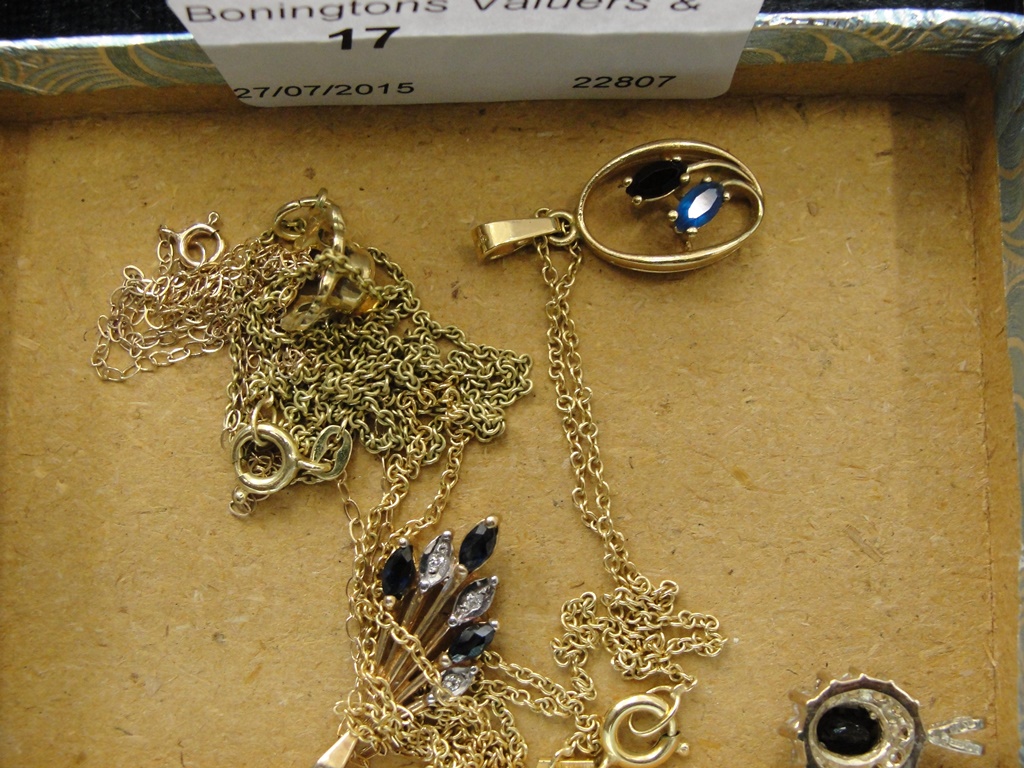 Four 9ct gold and stone set pendants