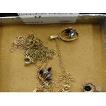 Four 9ct gold and stone set pendants