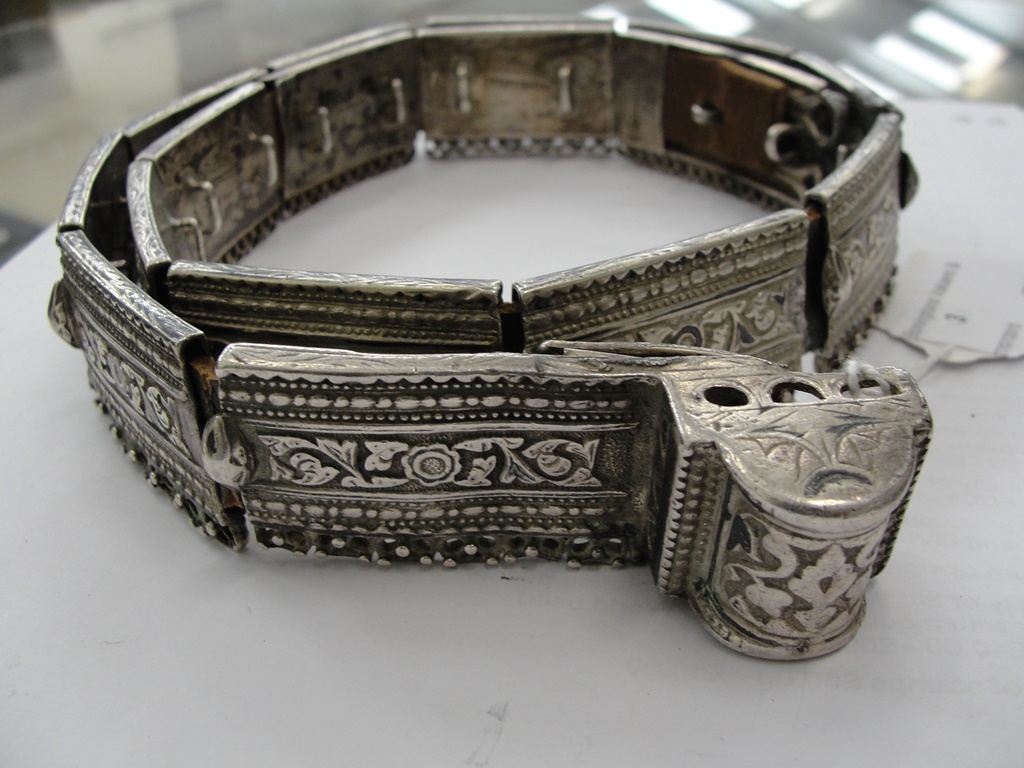 A 19th Century Russian Silver Belt:
a sleeved leather belt with 16 moulded silver sections and loop - Image 2 of 2