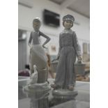 Two Lladro figurines of a milkboy and young girl with geese