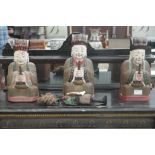 Three carved Chinese figures;