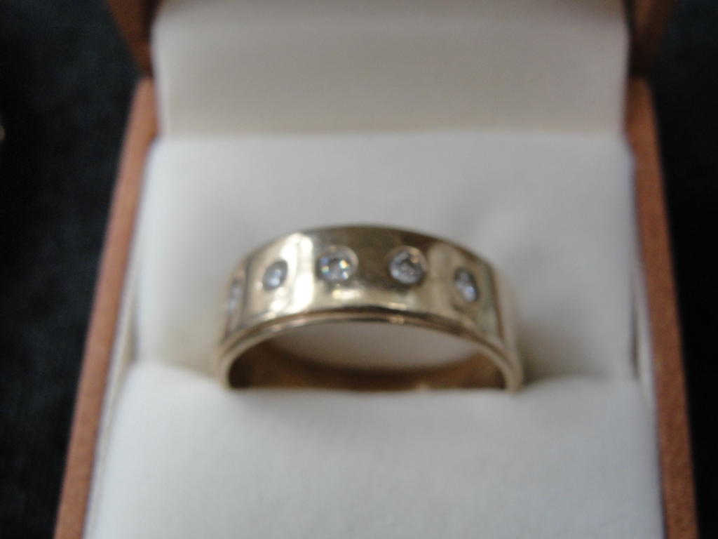 A large gentleman's 9ct diamond band