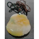 A Jadeite Bear and Crane Pendant:
in yellow,