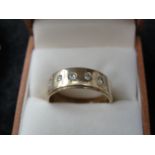 A large gentleman's 9ct diamond set dress ring.