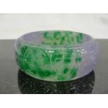 A Lilac and Green Jadeite Bangle with Carved Ruyi Shapes