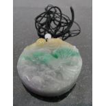 A Jadeite Eagle and Fish Pendant:
in green,