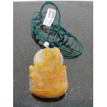 A Jadeite Pendant of Guan Gong in Lavender and Yellow strung on Green Silk