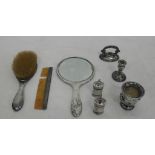 A HM silver squat candlestick; together with pepperettes, ,mirror brush,