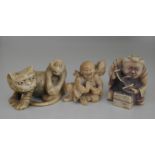 A Meiji period ivory Netsuke of a tiger and monkey;