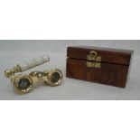 A boxed pair of mother-of-pearl opera glasses