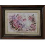 A hand-painted porcelain plaque depicting a decorative floral study,