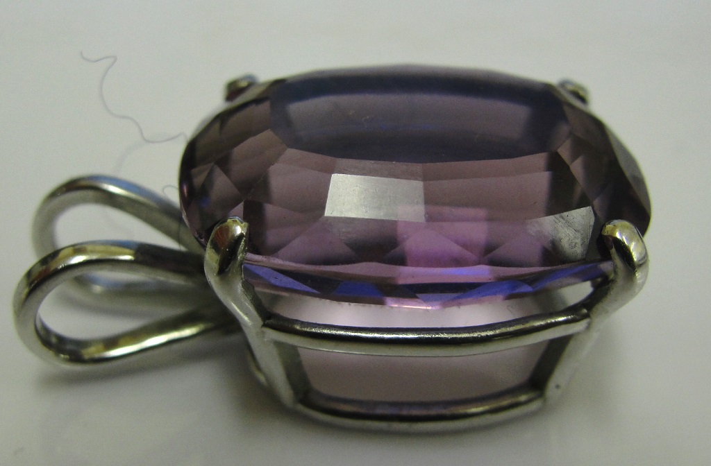 An amethyst set pendant