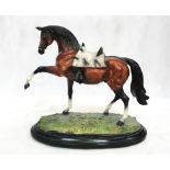 A resin model of a saddled horse