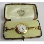 A cased 9ct trench watch