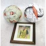 Two footballs signed by various Manchester United players from the 1990s and earlier;