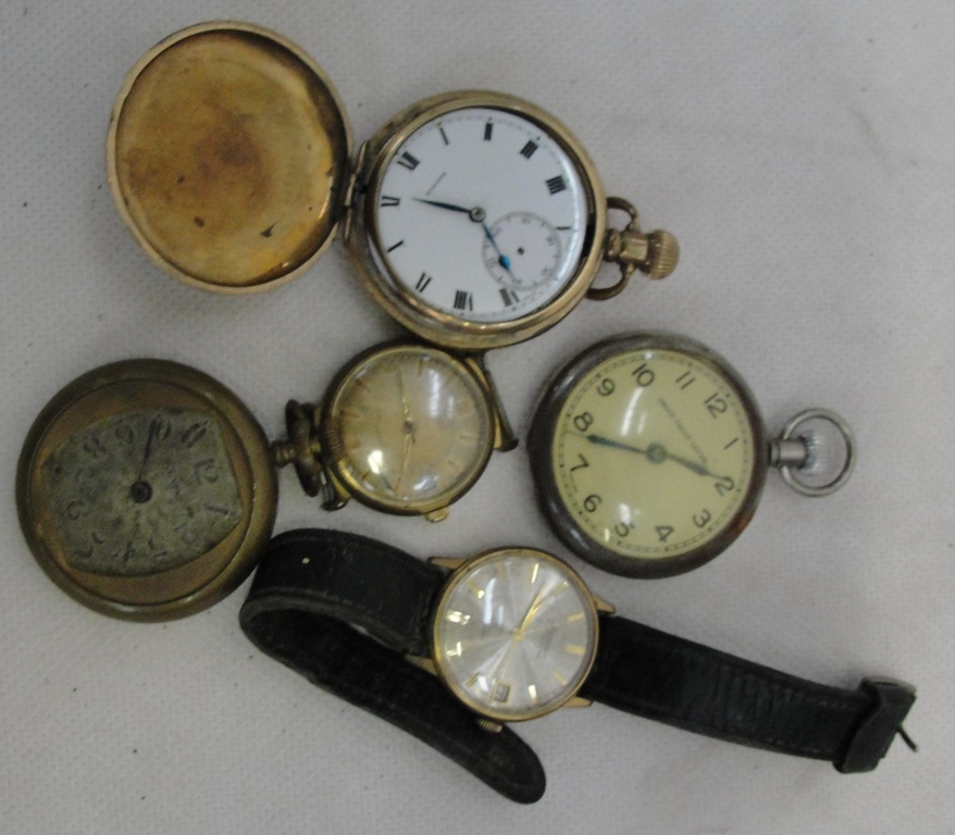 A collection of pocketwatches and wristwatches in various conditions