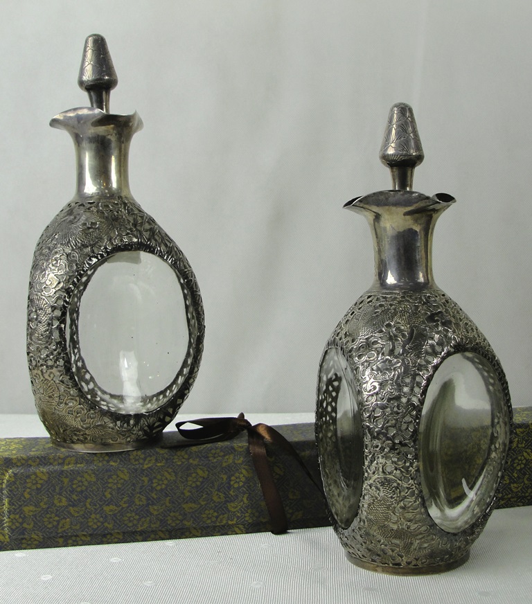 An Unusual Pair of Chinese Silver Mounted 'Dimple' decanters: with filigree work of a dragon, - Image 2 of 2