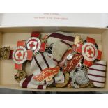 A quantity of Red Cross medals and badges,