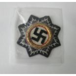 A WWII Luftwaffe embroidered gold cross