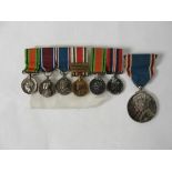 A 1937 Coronation medal; together with a miniature group, DM,